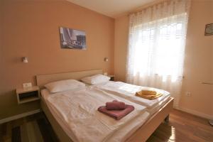 Ένα ή περισσότερα κρεβάτια σε δωμάτιο στο One Bedroom Apartment Bonsai with shared Pool +11 φωτογραφίες