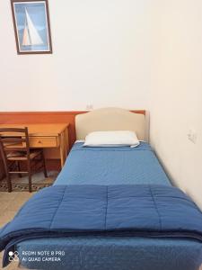 Un ou plusieurs lits dans un hébergement de l'établissement Soggiorno Emanuela