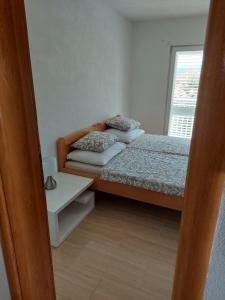 Posteľ alebo postele v izbe v ubytovaní Apartman Vučemil