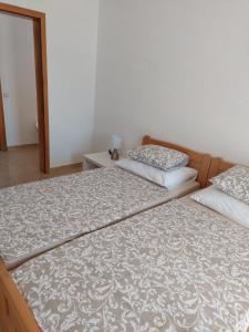 Posteľ alebo postele v izbe v ubytovaní Apartman Vučemil