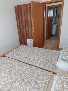 Posteľ alebo postele v izbe v ubytovaní Apartman Vučemil