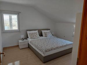 Posteľ alebo postele v izbe v ubytovaní Apartman Vučemil