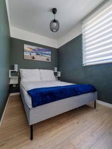 Katil atau katil-katil dalam bilik di Apartament Baltic Sunrise