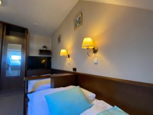 Posteľ alebo postele v izbe v ubytovaní Zámecký Hotel Zlatý Orel