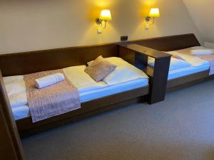 Posteľ alebo postele v izbe v ubytovaní Zámecký Hotel Zlatý Orel