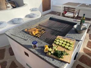 a grill with a bunch of food on top of it at Casa Susanne in Famara