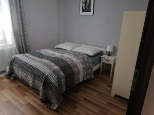Postel nebo postele na pokoji v ubytování Apartamenty pod Dzikowcem