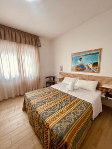 Giường trong phòng chung tại Hotel La Bussola