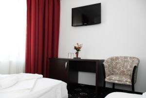 TV a/nebo společenská místnost v ubytování Hotel Cristian