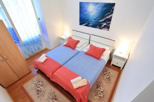 Postel nebo postele na pokoji v ubytování Apartment City Center Dragica