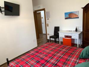 Televízia a/alebo spoločenská miestnosť v ubytovaní B & B Vigna Di Filippo - Paestum