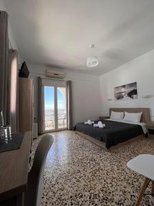 Postel nebo postele na pokoji v ubytování Firaxenia rooms