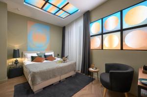Postel nebo postele na pokoji v ubytování Butik Art Hotel