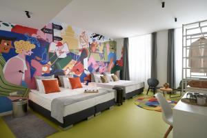 Postel nebo postele na pokoji v ubytování Butik Art Hotel
