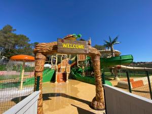 a water park with a water slide at Frantheor Fréjus 5 étoiles in Fréjus