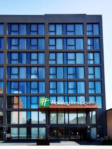 a building with a hilton inn express sign on it at Holiday Inn Express - NYC Brooklyn - Sunset Park, an IHG Hotel in Brooklyn