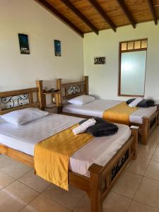 Cama ou camas em um quarto em Hotel San Felipe Belalcazar