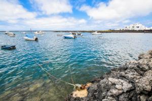 a group of boats in a large body of water at Cliff View Orzola in Orzola