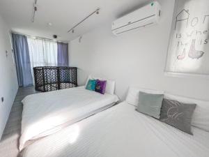 Postel nebo postele na pokoji v ubytování SHOW Liquiu B&B