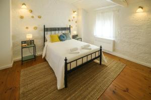 a bedroom with a large bed in a room with a window at Majestic Villa in Amarante with Private Pool in Amarante +45 photos