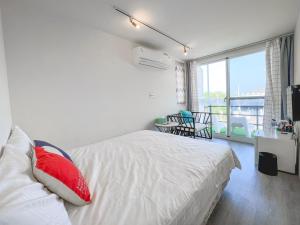 Postel nebo postele na pokoji v ubytování SHOW Liquiu B&B