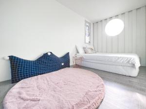 Postel nebo postele na pokoji v ubytování SHOW Liquiu B&B
