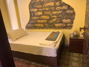 Ένα ή περισσότερα κρεβάτια σε δωμάτιο στο Gamaleya Boutique Hotel