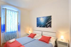 Postel nebo postele na pokoji v ubytování Apartment City Center Dragica