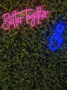 a sign that says better together on a plant at Smart Russell Square Hostel in London