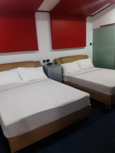 Postel nebo postele na pokoji v ubytování 999 Hotel