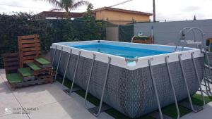 a swimming pool with a metal fence around it at Casa Enric 2 in Deltebre