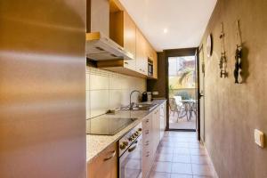 a kitchen with a sink and a counter at Ground floor apartment in Centre of Torroella De Montgri in Torroella de Montgrí