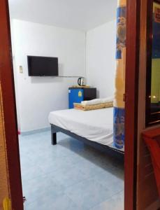 Postel nebo postele na pokoji v ubytování YaiJaew House