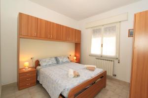 A bed or beds in a room at Borso D'Este 4