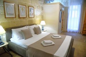 Letto o letti in una camera di Gawhra B&B