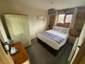 Krevet ili kreveti u jedinici u okviru objekta Swansea Log Cabin