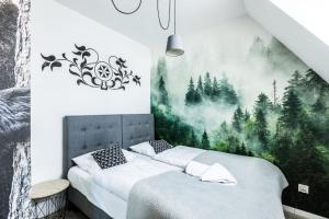 Posteľ alebo postele v izbe v ubytovaní ApartHost Apartament Wyjątkowe Kościelisko