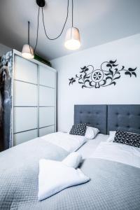 Posteľ alebo postele v izbe v ubytovaní ApartHost Apartament Wyjątkowe Kościelisko