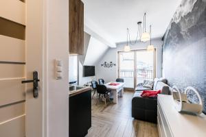 Televízia a/alebo spoločenská miestnosť v ubytovaní ApartHost Apartament Wyjątkowe Kościelisko