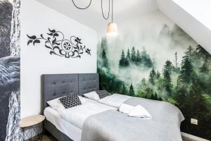 Posteľ alebo postele v izbe v ubytovaní ApartHost Apartament Wyjątkowe Kościelisko