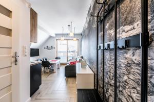 Televízia a/alebo spoločenská miestnosť v ubytovaní ApartHost Apartament Wyjątkowe Kościelisko