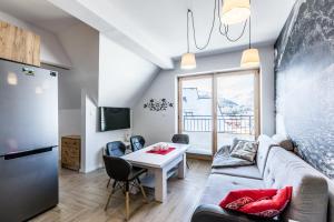 Televízia a/alebo spoločenská miestnosť v ubytovaní ApartHost Apartament Wyjątkowe Kościelisko