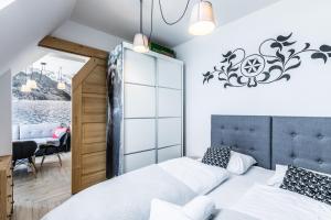 Posteľ alebo postele v izbe v ubytovaní ApartHost Apartament Wyjątkowe Kościelisko