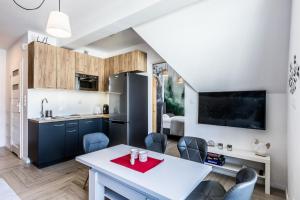 Kuchyňa alebo kuchynka v ubytovaní ApartHost Apartament Wyjątkowe Kościelisko