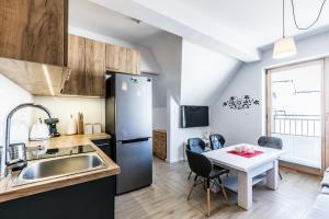 Kuchyňa alebo kuchynka v ubytovaní ApartHost Apartament Wyjątkowe Kościelisko
