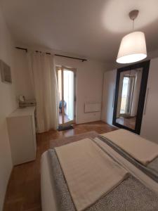 Posteľ alebo postele v izbe v ubytovaní BP APARTMAN + 23 fotografií
