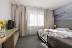 Postel nebo postele na pokoji v ubytování Baltic Hotel