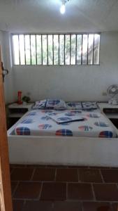 a large bed in a room with at Casa Campo Majo in Chinauta