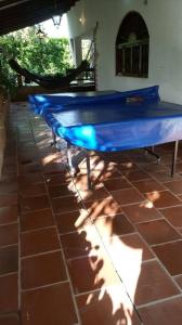 a blue ping pong table sitting on a patio at Casa Campo Majo in Chinauta