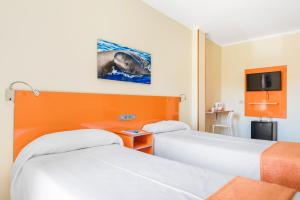 Postel nebo postele na pokoji v ubytování Hotel Andrea´s